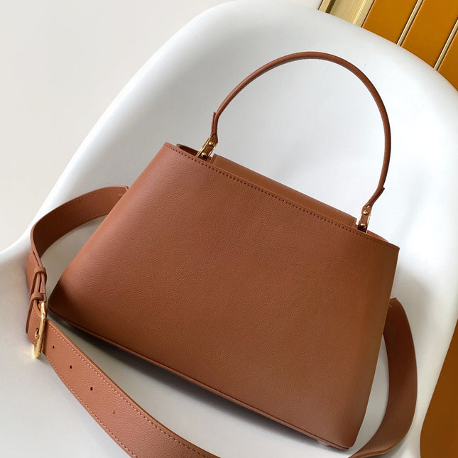 CAPUCINES 33 IN COGNAC CALFSKIN GOLD HARDWARE