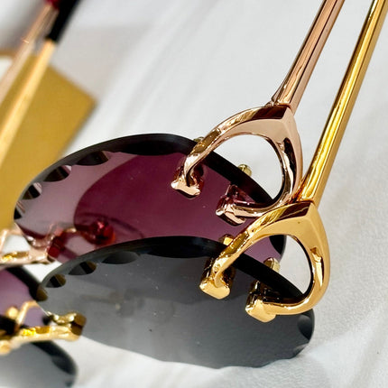 C DE RIMLESS ROUND FRAME SUNGLASSES CT0599S IN METAL
