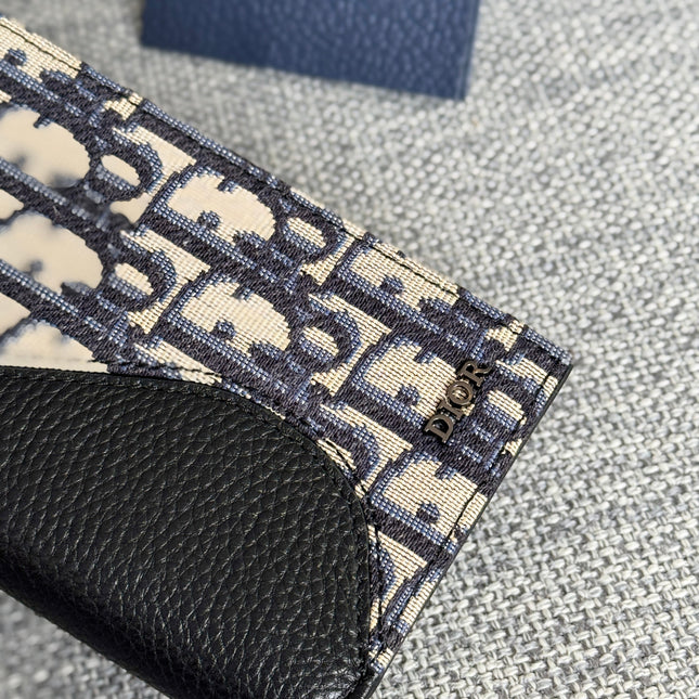 VERTICAL BIFOLD WALLET 19 IN BLACK GRAINED CALFSKIN MIX BLUE MONOGRAM OBLIQUE JACQUARD