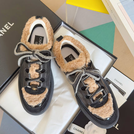 CHANEL 25S SNEAKERS WITH FUR ACCENTS 40MM IN BLACK AND BROWN CALFSKIN