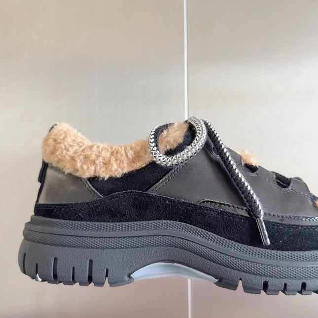 CHANEL 25S SNEAKERS WITH FUR ACCENTS 40MM IN BLACK AND BROWN CALFSKIN