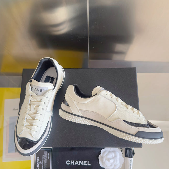 CHANEL 25S SNEAKERS WITH PATENT TOE 20MM IN WHITE CALFSKIN