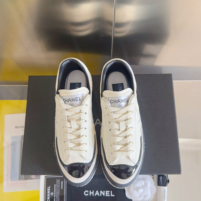 CHANEL 25S SNEAKERS WITH PATENT TOE 20MM IN WHITE CALFSKIN