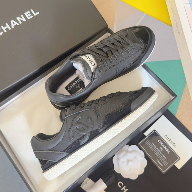 CHANEL 25S SNEAKERS WITH PATENT TOE 20MM IN BLACK CALFSKIN