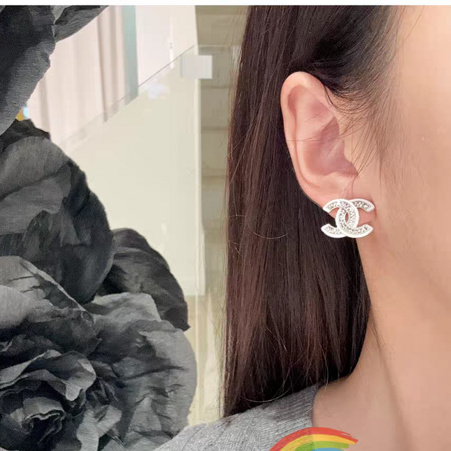 DOUBLE C STUD EARRINGS WITH WHITE TRIM AND CLEAR STONE LOGO