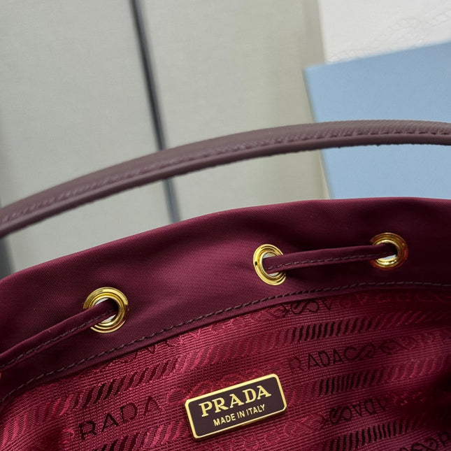 PRADA 25S DUET BUCKET BAG 23 IN BURGUNDY RE-NYLON GOLD HARDWRE