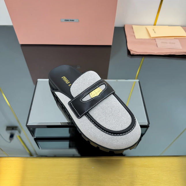 MULES SLIPPERS IN BLACK CALFSKIN AND WHITE DOTS CANVAS WITH GOLD COIN