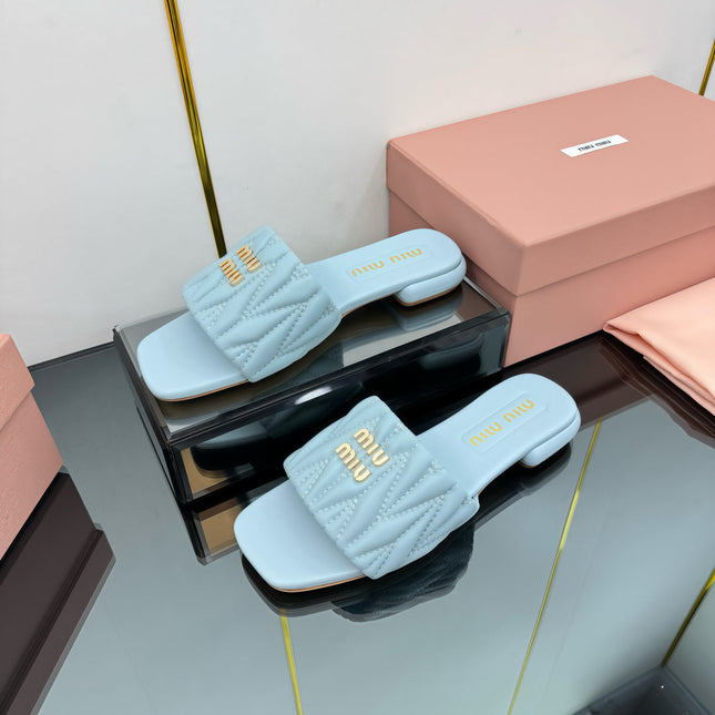 MATELASSÉ SLIDES IN BABY BLUE CALFSKIN