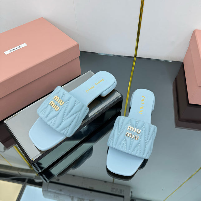 MATELASSÉ SLIDES IN BABY BLUE CALFSKIN