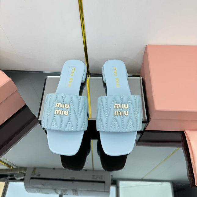 MATELASSÉ SLIDES IN BABY BLUE CALFSKIN