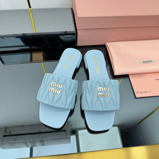 MATELASSÉ SLIDES IN BABY BLUE CALFSKIN
