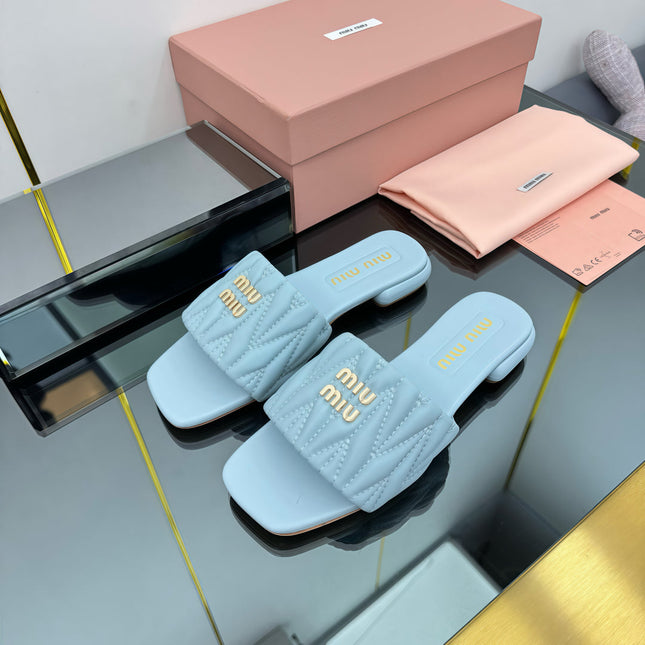 MATELASSÉ SLIDES IN BABY BLUE CALFSKIN