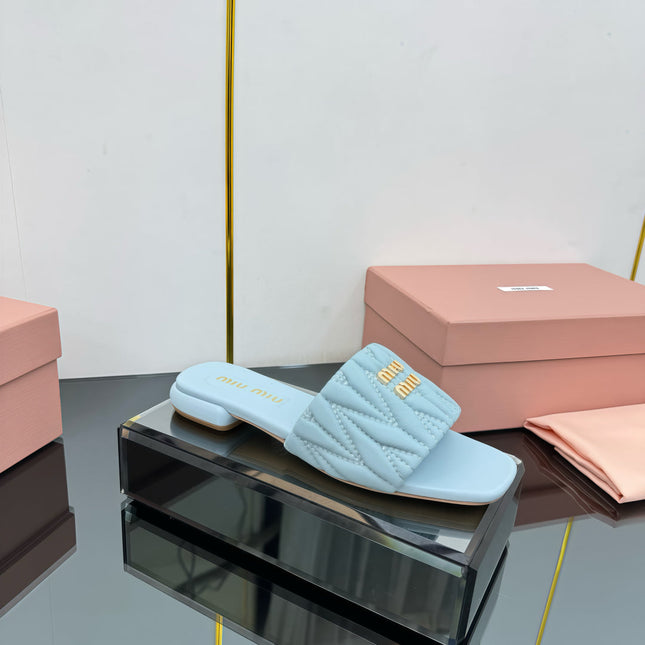 MATELASSÉ SLIDES IN BABY BLUE CALFSKIN