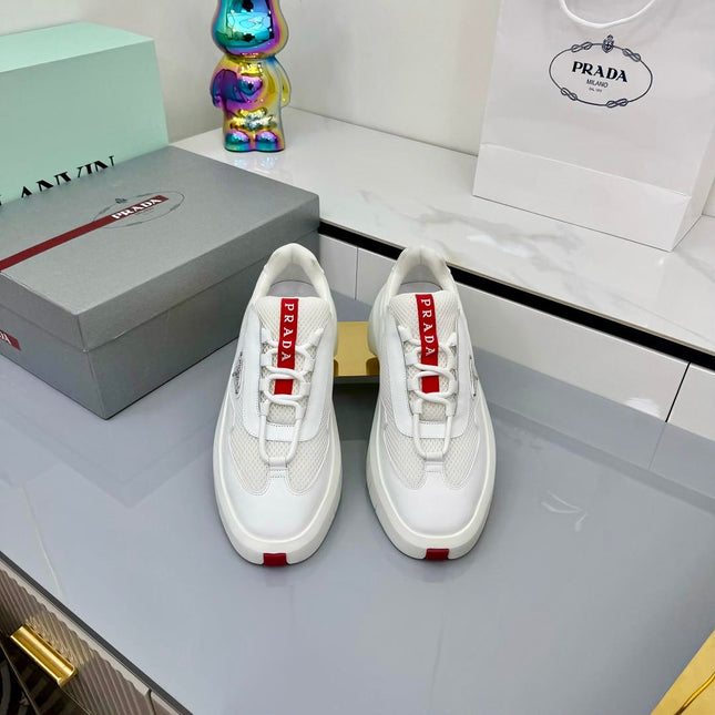 PRADA 25S CROSS LACED SNEAKERS IN WHITE CALFSKIN