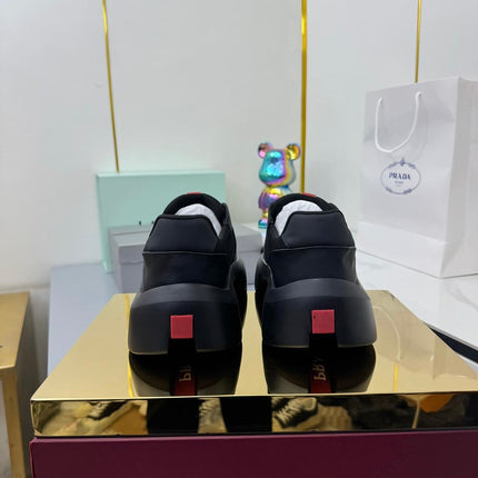 PRADA 25S CROSS LACED SNEAKERS IN BLACK CALFSKIN