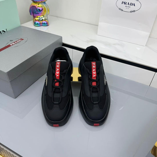 PRADA 25S CROSS LACED SNEAKERS IN BLACK CALFSKIN