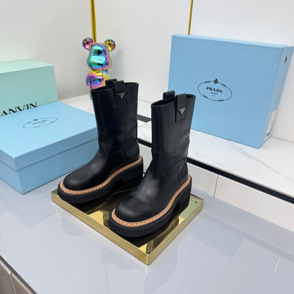 PRADA 25S HIGH MARTIN BOOTS 50MM IN BLACK CALFSKIN