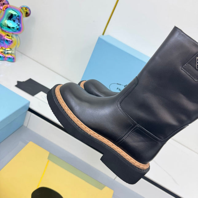 PRADA 25S HIGH MARTIN BOOTS 50MM IN BLACK CALFSKIN