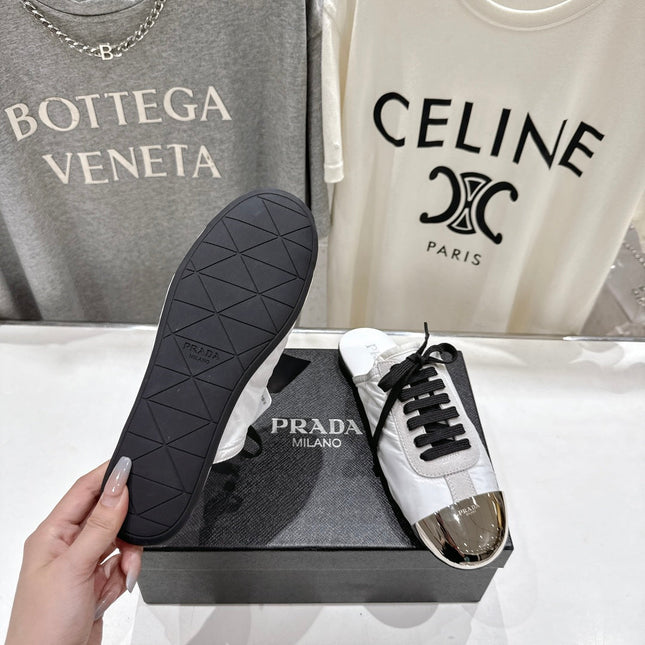 PRADA 25S MULES IN WHITE WITH METAL TOECAP
