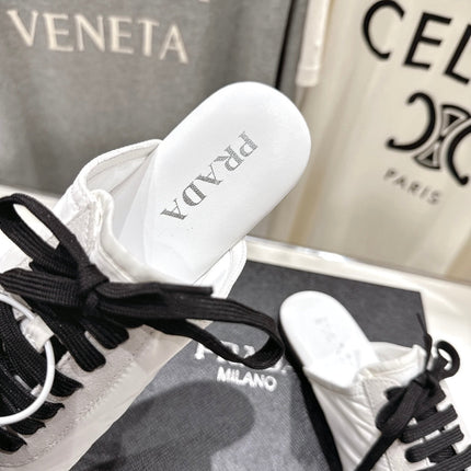 PRADA 25S MULES IN WHITE WITH METAL TOECAP