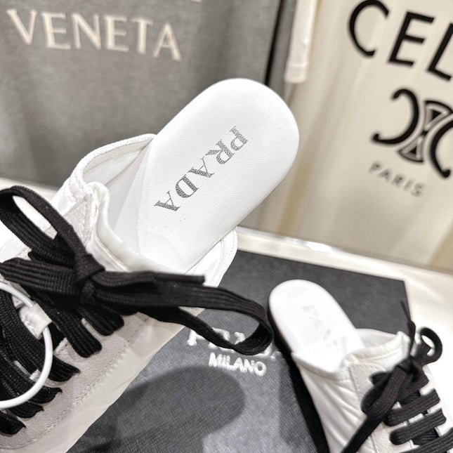 PRADA 25S MULES IN WHITE WITH METAL TOECAP