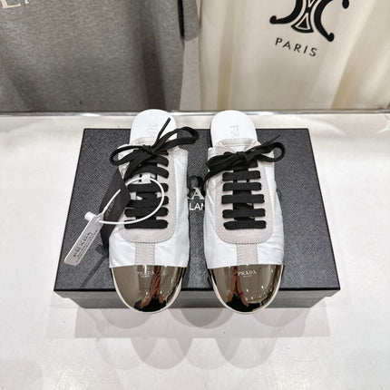 PRADA 25S MULES IN WHITE WITH METAL TOECAP