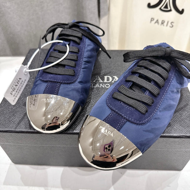 PRADA 25S MULES IN DARK BLUE WITH METAL TOECAP