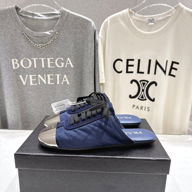 PRADA 25S MULES IN DARK BLUE WITH METAL TOECAP