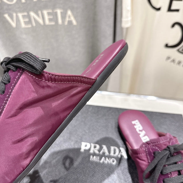 PRADA 25S MULES IN PLUM WITH METAL TOECAP