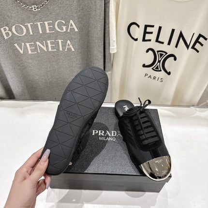 PRADA 25S MULES IN BLACK WITH METAL TOECAP