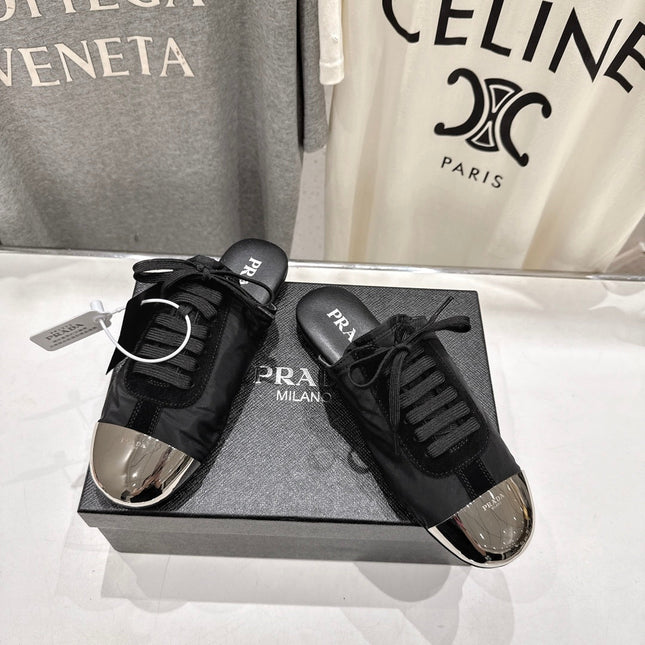 PRADA 25S MULES IN BLACK WITH METAL TOECAP
