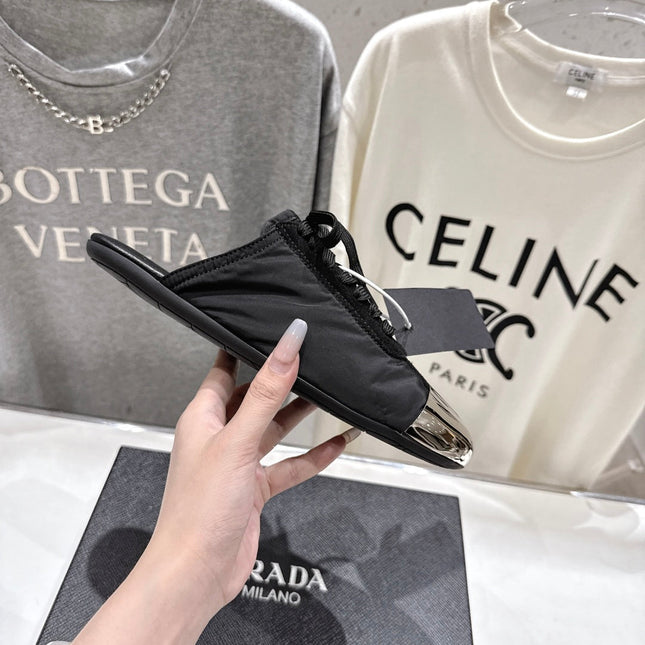 PRADA 25S MULES IN BLACK WITH METAL TOECAP