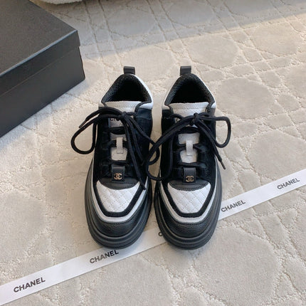 CHANEL 25S TRAINERS 40MM IN BLACK AND WHITE CALFSKIN AND SUEDE