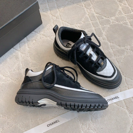 CHANEL 25S TRAINERS 40MM IN BLACK AND WHITE CALFSKIN AND SUEDE