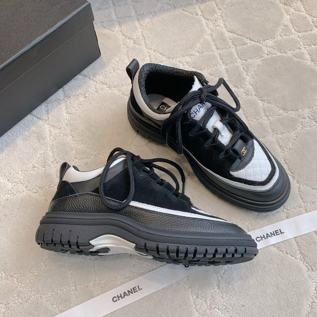CHANEL 25S TRAINERS 40MM IN BLACK AND WHITE CALFSKIN AND SUEDE