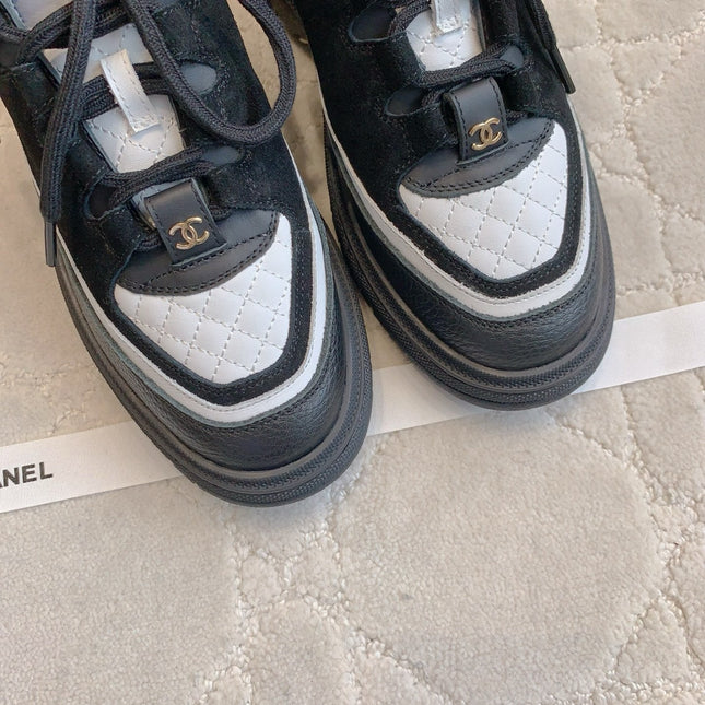 CHANEL 25S TRAINERS 40MM IN BLACK AND WHITE CALFSKIN AND SUEDE