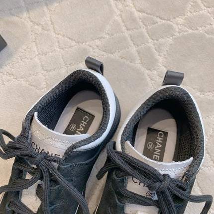 CHANEL 25S TRAINERS 40MM IN BLACK AND WHITE CALFSKIN AND SUEDE
