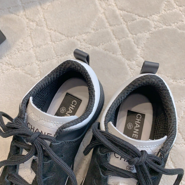 CHANEL 25S TRAINERS 40MM IN BLACK AND WHITE CALFSKIN AND SUEDE