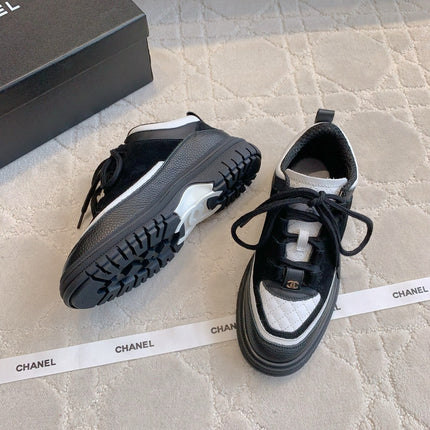 CHANEL 25S TRAINERS 40MM IN BLACK AND WHITE CALFSKIN AND SUEDE