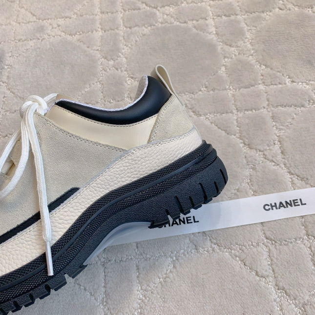 CHANEL 25S TRAINERS 40MM IN WHITE AND BLACK CALFSKIN