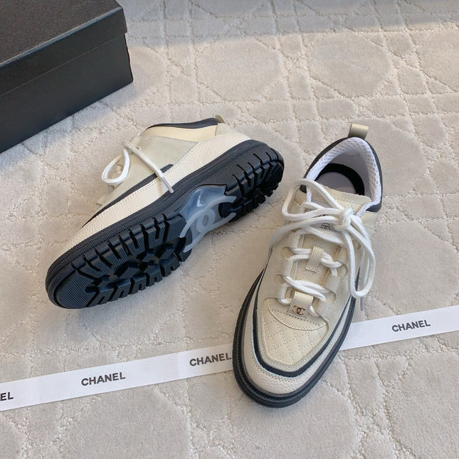 CHANEL 25S TRAINERS 40MM IN WHITE AND BLACK CALFSKIN