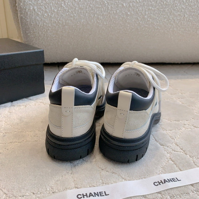 CHANEL 25S TRAINERS 40MM IN WHITE AND BLACK CALFSKIN