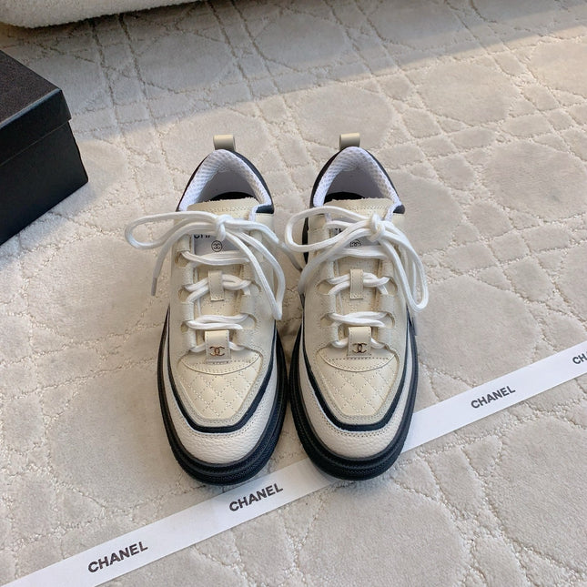 CHANEL 25S TRAINERS 40MM IN WHITE AND BLACK CALFSKIN