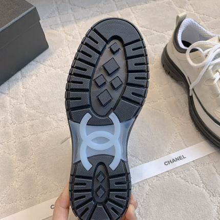 CHANEL 25S TRAINERS 40MM IN WHITE AND BLACK CALFSKIN