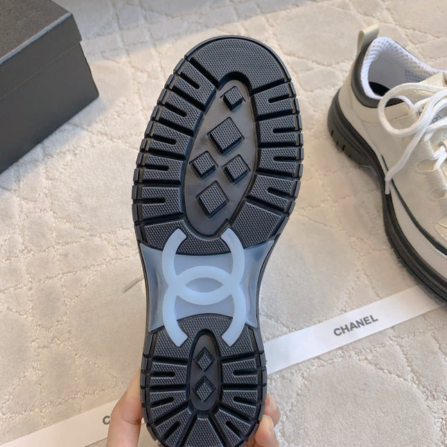 CHANEL 25S TRAINERS 40MM IN WHITE AND BLACK CALFSKIN