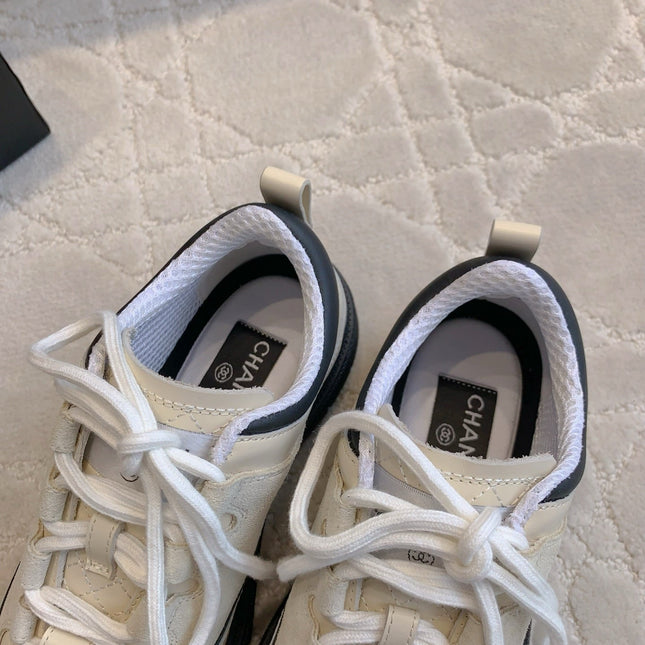 CHANEL 25S TRAINERS 40MM IN WHITE AND BLACK CALFSKIN