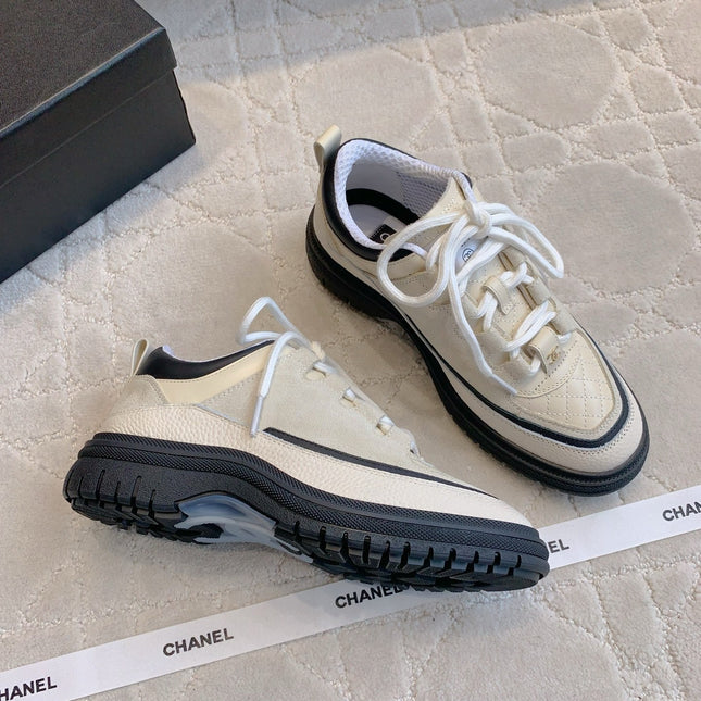 CHANEL 25S TRAINERS 40MM IN WHITE AND BLACK CALFSKIN