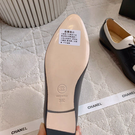 CHANEL 25S TWO TONE LACE UP IN BLACK AND WHITE CALFSKIN