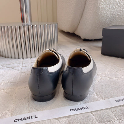 CHANEL 25S TWO TONE LACE UP IN BLACK AND WHITE CALFSKIN