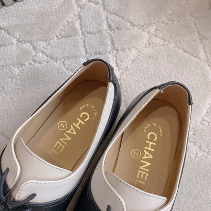 CHANEL 25S TWO TONE LACE UP IN BLACK AND WHITE CALFSKIN